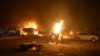 Vehicles on fire after a roadside bomb attack in Quetta that killed at least 15 soldiers and civilians on August 12.
