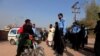 Police block the road leading to the house of Pakistani opposition leader Imran Khan in Islamabad, Pakistan, on October 28.