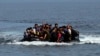 Refugees from Afghanistan arrive in an overloaded rubber dinghy at the coast near Mytilini, Lesbos island, Greece, after crossing the Mediterranean Sea from Turkey. (file photo)