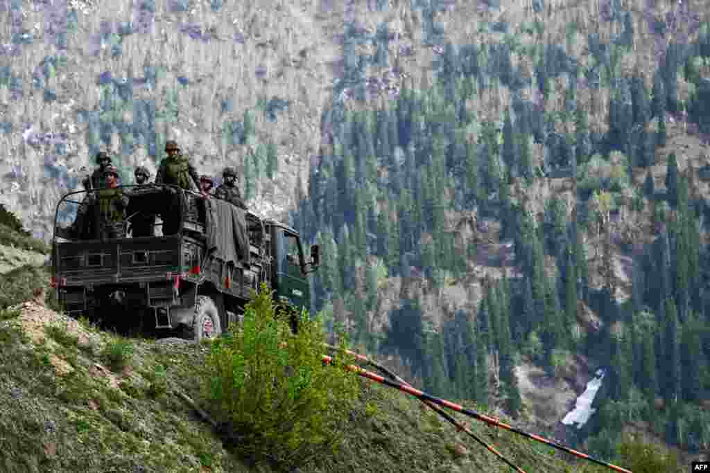 IndianArmy soldiers stand guard near the Line of Control between Pakistan and India in Indian-administered Kashmir.