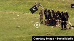 Grab from a video that shows militants loyal to the Islamic State (IS) blowing up bound and blindfolded Afghan prisoners with explosives. The victims were from Nangarhar province.IS issued the video in August 2015.