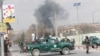 Afghan security forces guard the area as smoke billows from the Sardar Daud Khan hospital, also known as the Kabul Military Hospital, during an attack by suspected militants in Kabul on March 8.
