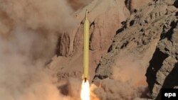 An Iranian long range missile Qadr is launched at an undisclosed location in Iran on March 9.