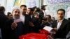 Iran's President Hassan Rouhani casts his ballot during the presidential election in Tehran on May 19.