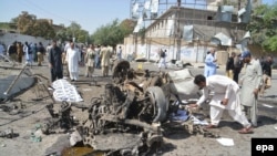Pakistani security officials inspect the scene of a suicide bomb attack in Quetta on June 23.