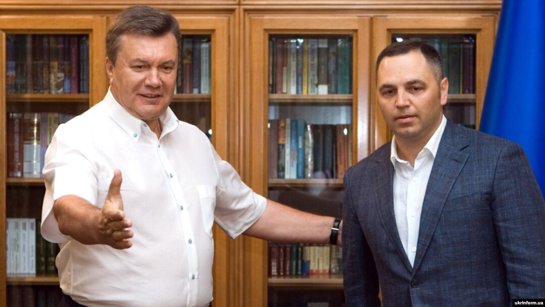 The former Ukrainian parliamentarian who disclosed the personal information, Andriy Portnov (right), used to serve as chief of staff to ex-President Viktor Yanukovych (left). 