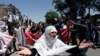 Afghanistan - An Afghan woman chants slogans during a protest in Kabul, Afghanistan June 2, 2017