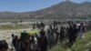 Mourners carry the coffin of one of the 150 victims killed in Kabul on May 31.