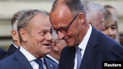 Polşa baş naziri Donald Tusk və Almaniya kansleri Fridrix Merts