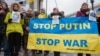 At a January 21 protest on Kyiv's Independence Square, activists demanded the president of Russia, Vladimir Putin, withdraw Russian troops from Eastern Ukraine. 
